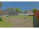 Spacious backyard with a screened-in pool, storage shed, and partially fenced for added privacy at 6211 Se 126Th St, Belleview, FL 34420
