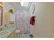 Bathroom with updated flooring, a skylight above the shower-tub, and a single vanity at 6211 Se 126Th St, Belleview, FL 34420