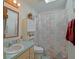 Bright bathroom features a shower-tub combo, vanity with storage, and linen closet at 6211 Se 126Th St, Belleview, FL 34420