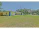 Nice-sized well-maintained lawn surrounding a single-story home with a two-car garage at 6211 Se 126Th St, Belleview, FL 34420