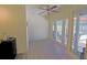 Florida room featuring wood-look floors, access to the backyard, and a cooling ceiling fan at 6211 Se 126Th St, Belleview, FL 34420
