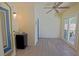Florida room with wood-look floors, ceiling fan, and access to the outdoors at 6211 Se 126Th St, Belleview, FL 34420