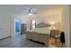 Comfortable main bedroom with neutral tones, ample storage, and an ensuite bathroom at 6211 Se 126Th St, Belleview, FL 34420