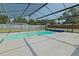 Large enclosed pool with bright blue water at 6211 Se 126Th St, Belleview, FL 34420