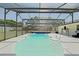Large screened-in pool provides a refreshing escape, enhanced by a spacious deck and covered lounging at 6211 Se 126Th St, Belleview, FL 34420