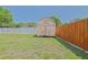 Backyard shed offers extra storage, blending functionality with the property's charm at 6211 Se 126Th St, Belleview, FL 34420