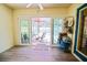 Enclosed sun room leads to the screened-in pool area, perfect for entertaining and relaxation at 6211 Se 126Th St, Belleview, FL 34420