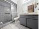 Bathroom featuring a walk-in shower with glass door and gray vanity at 70 Almond Pass Dr, Ocala, FL 34472