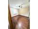 Bright bedroom featuring a ceiling fan and wood laminate flooring at 70 Almond Pass Dr, Ocala, FL 34472