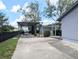 Exterior showcasing the carport, backyard and shed, creating a functional outdoor space at 70 Almond Pass Dr, Ocala, FL 34472