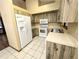 A functional kitchen featuring updated appliances, plenty of counter space and tile flooring at 70 Almond Pass Dr, Ocala, FL 34472