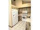 A modern kitchen featuring updated appliances, ample counter space and tile flooring at 70 Almond Pass Dr, Ocala, FL 34472