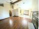 Bright living room featuring hardwood floors, fireplace, high ceilings and open floor plan at 70 Almond Pass Dr, Ocala, FL 34472