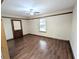 View of the living room featuring wood laminate flooring and a ceiling fan at 70 Almond Pass Dr, Ocala, FL 34472