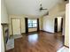Cozy living area featuring hardwood floors, a fireplace and ample natural light at 70 Almond Pass Dr, Ocala, FL 34472