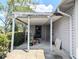 Covered patio with gray siding and tools at 70 Almond Pass Dr, Ocala, FL 34472