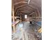 Interior of a large shed with shelving, offering plenty of storage and workshop space at 70 Almond Pass Dr, Ocala, FL 34472