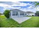 The back exterior features a screened in porch with a paved patio area at 7270 Sw 99Th Cir, Ocala, FL 34481