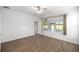 Bedroom features wood flooring, a ceiling fan and a sunroom at 7270 Sw 99Th Cir, Ocala, FL 34481