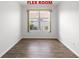 Flex room with neutral paint, wood flooring, and a window at 7270 Sw 99Th Cir, Ocala, FL 34481