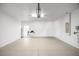 Spacious garage featuring a garage door and an entrance into the house at 7270 Sw 99Th Cir, Ocala, FL 34481