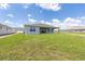 Beautiful backyard featuring a well-kept lawn, patio, and home exterior at 7536 Sw 60Th St, Ocala, FL 34476