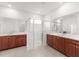 Bright bathroom with a glass enclosed shower, dual vanities, and modern fixtures at 7536 Sw 60Th St, Ocala, FL 34476