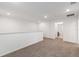 Upstairs landing featuring neutral carpeting and access to a bathroom at 7536 Sw 60Th St, Ocala, FL 34476