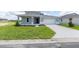 Charming two-story home featuring a well-manicured lawn and a two-car garage with stylish curb appeal at 7536 Sw 60Th St, Ocala, FL 34476