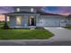 Charming two-story home featuring a well-manicured lawn and a two-car garage with stylish curb appeal at 7536 Sw 60Th St, Ocala, FL 34476