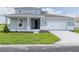 Charming two-story home featuring a well-manicured lawn and a two-car garage with stylish curb appeal at 7536 Sw 60Th St, Ocala, FL 34476