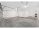 Spacious garage with high ceilings and an automatic door at 7536 Sw 60Th St, Ocala, FL 34476