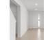 Open hallway with tile flooring providing seamless transition and connectivity throughout the home at 7536 Sw 60Th St, Ocala, FL 34476