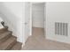 Hallway leading to walk-in closet, tiled floor, and white doors at 7536 Sw 60Th St, Ocala, FL 34476