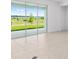 Bright living room with sliding glass doors offering scenic views and enhancing the home's natural light at 7536 Sw 60Th St, Ocala, FL 34476