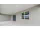 Covered patio with sliding glass door and windows bringing the outdoors in at 7536 Sw 60Th St, Ocala, FL 34476