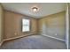 A carpeted bedroom featuring a window letting in natural light and neutral-toned walls at 8040 Sw 131St Ln, Ocala, FL 34473