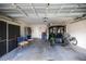 Spacious garage with a golf cart, bicycle, built in storage, and convenient access to your vehicles at 8352 Se 168Th Trinity Pl, The Villages, FL 32162