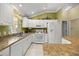 Modern kitchen with white cabinetry, stainless steel appliances, and a bright, airy feel at 8352 Se 168Th Trinity Pl, The Villages, FL 32162