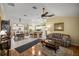 Open-concept living space with kitchen bar, dining area, and comfortable seating at 8352 Se 168Th Trinity Pl, The Villages, FL 32162