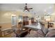 Bright living space connecting the kitchen, dining area, and additional living spaces at 8352 Se 168Th Trinity Pl, The Villages, FL 32162