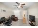 Home office setup with a desk, chair, and television at 8352 Se 168Th Trinity Pl, The Villages, FL 32162