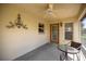 Comfortable outdoor patio area with neutral paint and a metal decor adds charm to this relaxing space at 8352 Se 168Th Trinity Pl, The Villages, FL 32162