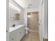 Bathroom featuring vanity with storage and shower with glass door at 8463 Sw 108Th Ln, Ocala, FL 34481