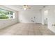 Unfurnished bedroom featuring large window providing natural light and tile flooring at 8463 Sw 108Th Ln, Ocala, FL 34481