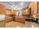 Traditional kitchen with wooden cabinets, granite countertops, tile backsplash and stainless steel appliances at 8463 Sw 108Th Ln, Ocala, FL 34481