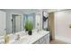 Bathroom featuring double sinks, ample counter space, and decor that complements the space at 8647 Sw 44Th Ter, Ocala, FL 34476