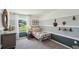 Cozy bedroom with a window view, featuring stylish decor and a comfortable bed at 8647 Sw 44Th Ter, Ocala, FL 34476