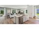Open-concept kitchen with an island flows into the living area, perfect for entertaining and Gathering gatherings at 8647 Sw 44Th Ter, Ocala, FL 34476