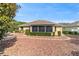 Lush backyard featuring stone landscaping and mature trees and fountain, perfect for outdoor enjoyment and relaxation at 8650 Sw 83Rd Loop, Ocala, FL 34481